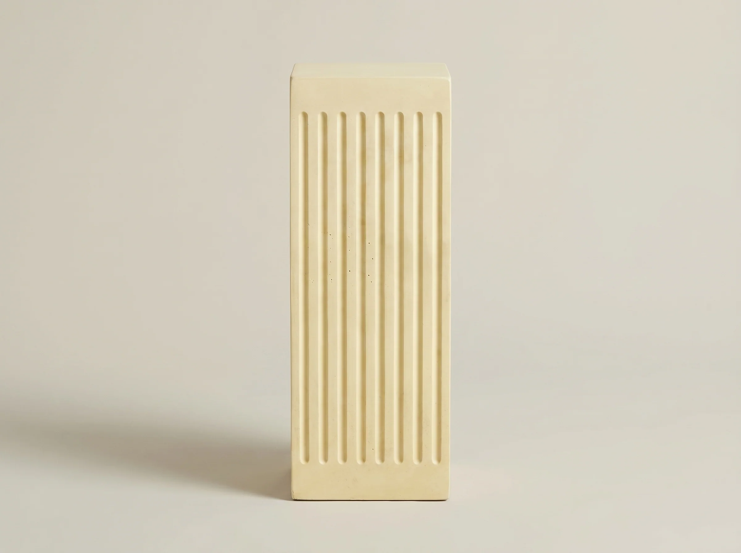 Coronado Fluted Concrete Side Table in Cream Cement, In situ